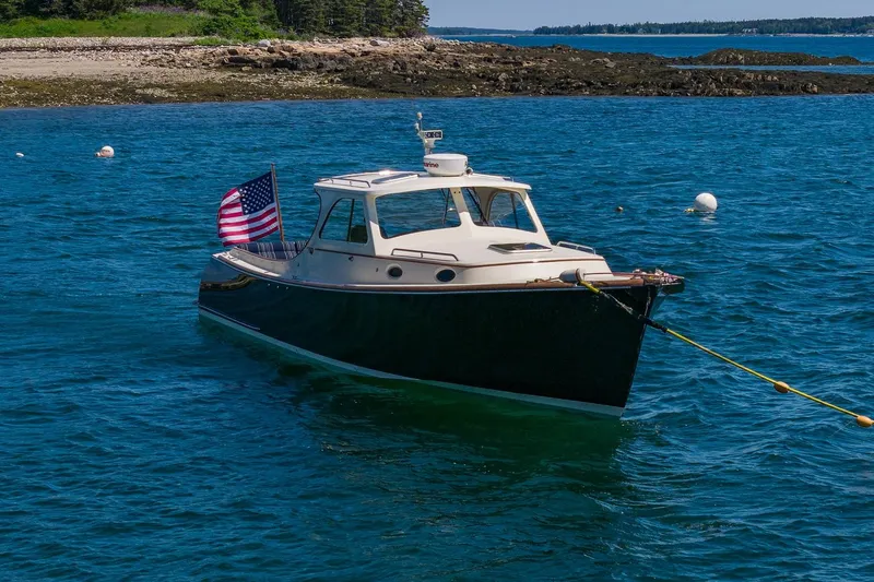 Slide: The Image of 2001 Hinckley Picnic Boat 36 Classic anchored in scenic coastal waters. - 9