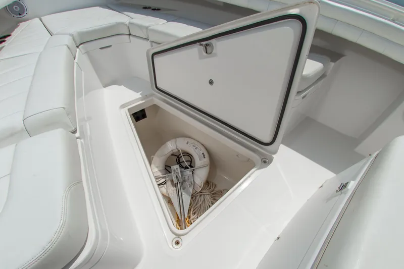 Slide: The Image of 2019 Regulator 31 boat storage compartment with anchor and rope. - 30