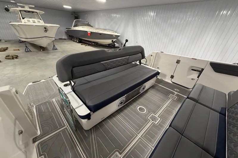 Slide: The Image of Interior of a 2027 Regal 38 Surf boat in a storage facility. - 12