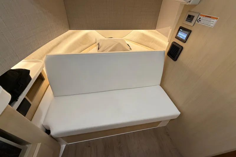 Slide: The Image of 2027 Regal 38 Surf cabin interior with modern seating and control panel. - 21