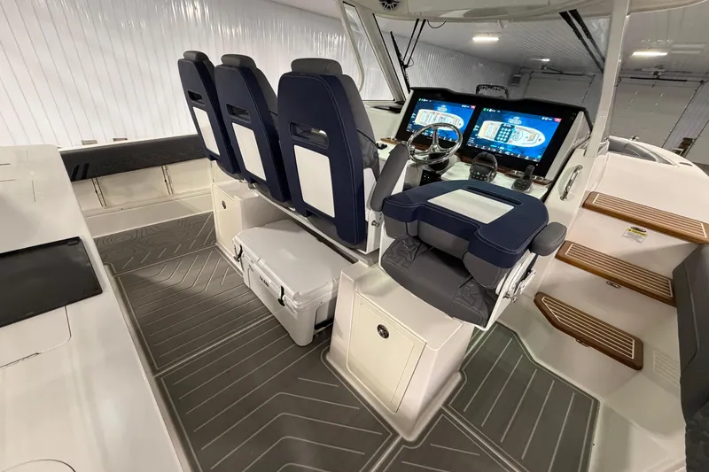 Slide: The Image of 2027 Regal 38 Surf boat interior with modern helm, dual screens, and comfortable seating. - 3