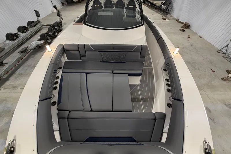 Slide: The Image of 2027 Regal 38 Surf boat interior with luxurious seating in a spacious cabin. - 31