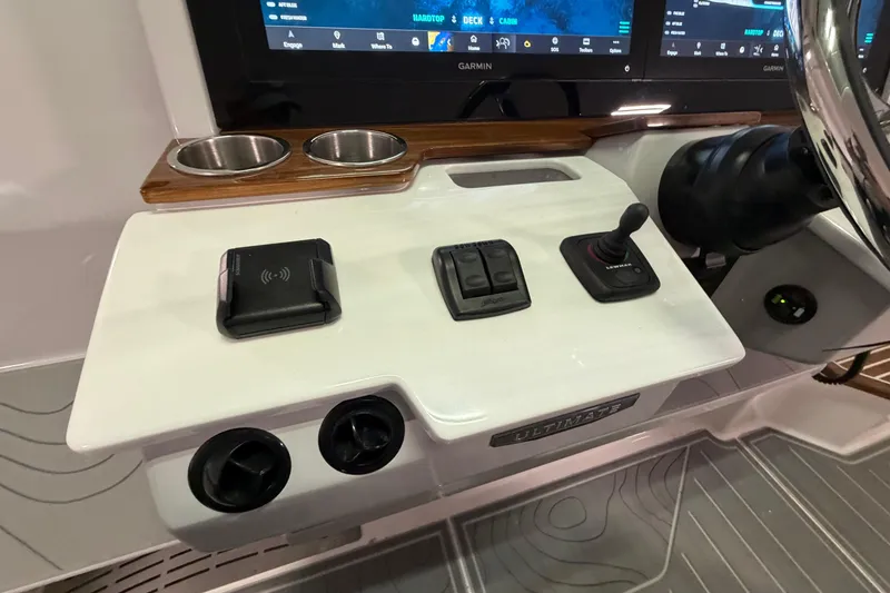 Slide: The Image of Control panel of 2027 Regal 38 Surf boat with modern navigation features. - 33