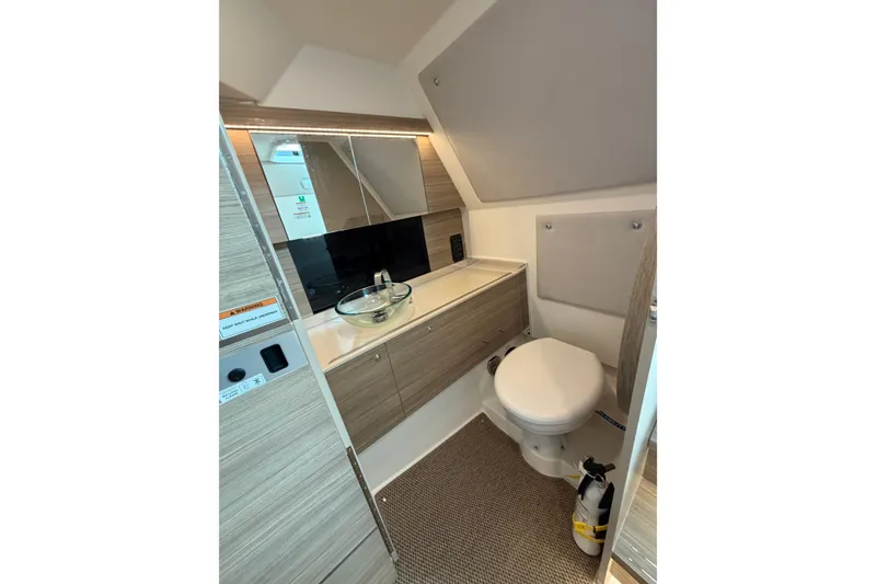 Slide: The Image of Modern bathroom interior of 2025 Saxdor 320 GTC boat, featuring sleek design and compact amenities. - 30