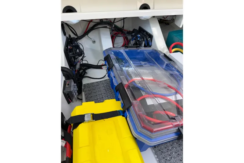 Slide: The Image of Interior view of 2025 Saxdor 320 GTC boat showing organized wiring and storage compartments. - 39