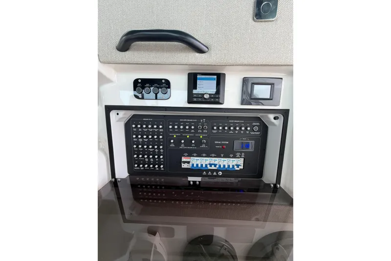 Slide: The Image of Control panel of 2025 Saxdor 320 GTC boat, featuring advanced navigation and system controls. - 31