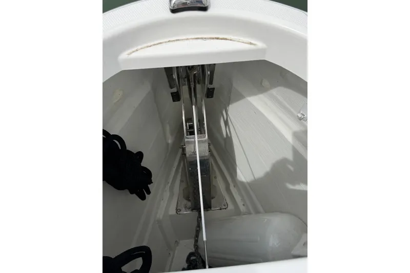Slide: The Image of Anchor compartment of 2025 Saxdor 320 GTC boat, featuring chain and rope storage. - 51