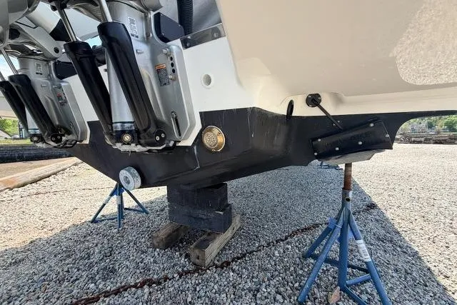 Slide: The Image of 2025 Saxdor 320 GTC boat hull on stands, showcasing engine mounts and underbody. - 52