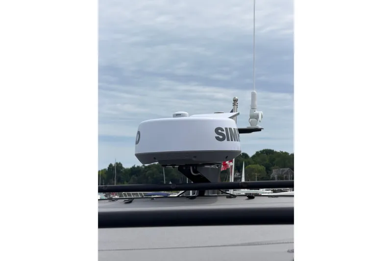 Slide: The Image of Radar equipment on a 2025 Saxdor 320 GTC boat against a cloudy sky backdrop. - 36