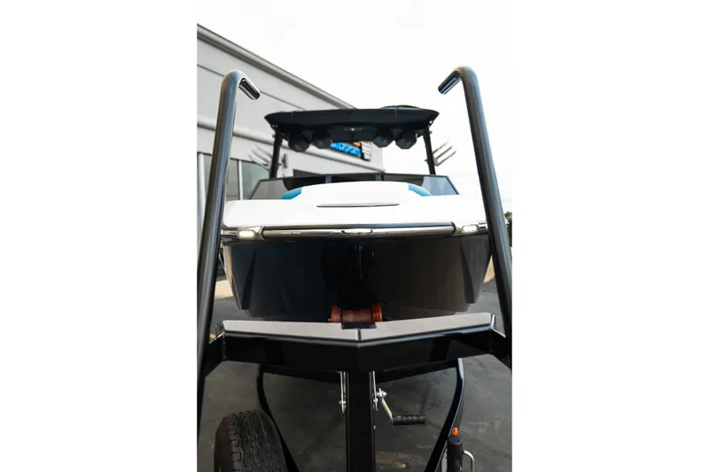 Slide: The Image of 2024 Tigé Z5 boat on trailer, viewed from the front, showcasing sleek design. - 10