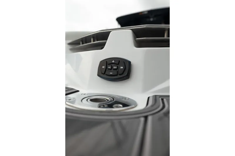 Slide: The Image of Close-up of 2024 Tigé Z5 boat control panel with buttons. - 16