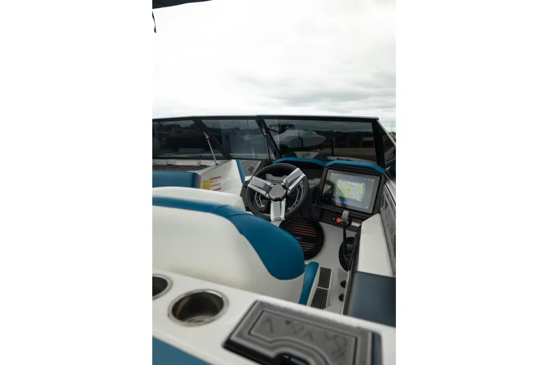 Slide: The Image of 2024 Tigé Z5 boat interior with steering wheel and navigation display. - 18