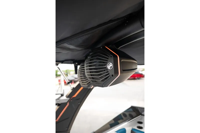 Slide: The Image of 2024 Tigé Z5 boat speaker system with sleek design and orange accents. - 22