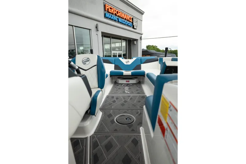 Slide: The Image of 2024 Tigé Z5 boat interior with blue and white seating at Performance Marine Watersports. - 27