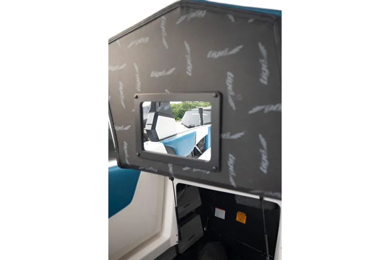 Slide: The Image of 2024 Tigé Z5 boat interior with storage compartment and seating view. - 31