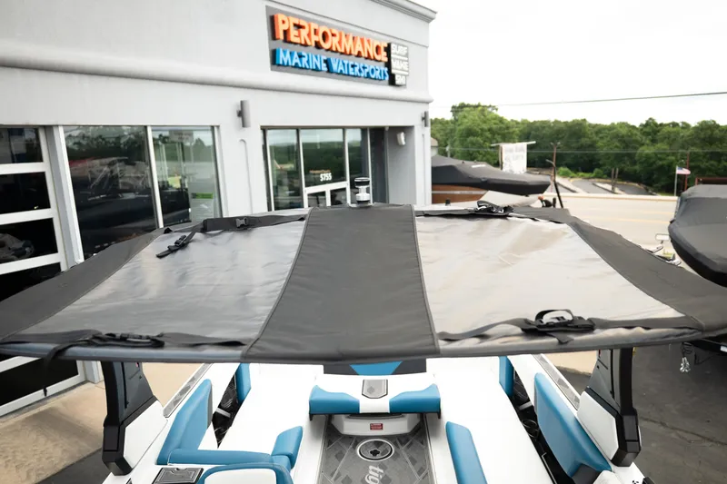Slide: The Image of 2024 Tigé Z5 boat with canopy at Performance Marine Watersports dealership. - 36