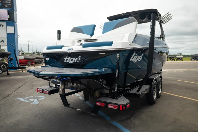 Slide: The Image of 2024 Tigé Z5 boat on trailer, parked in a lot, rear view. - 8