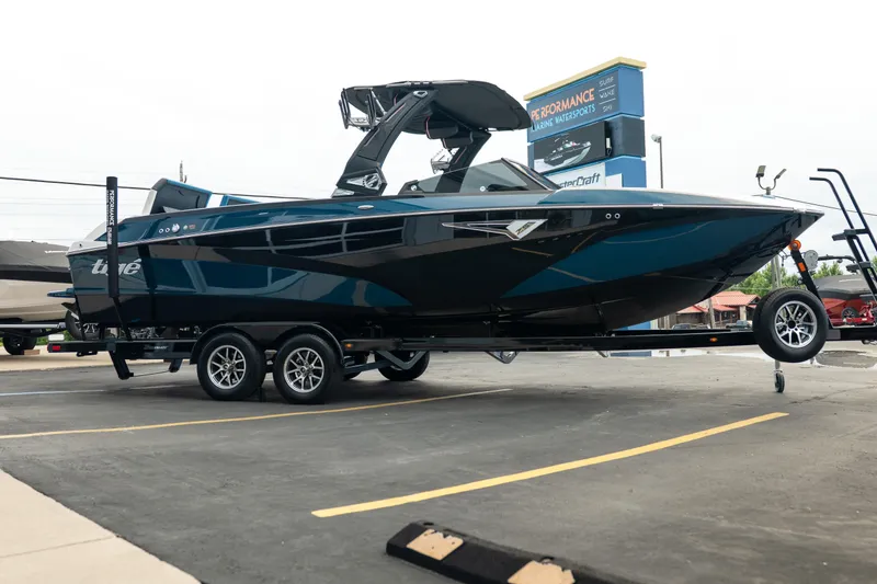 Slide: The Image of 2024 Tigé Z5 boat on trailer in parking lot, side view. - 9
