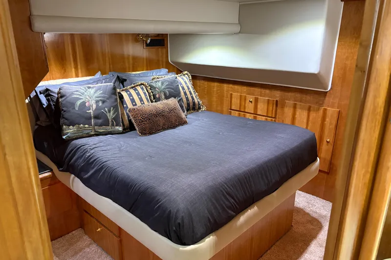 Slide: The Image of Luxurious bedroom in 2001 Navigator Yacht 5600 Pilothouse Classic with elegant bedding. - 12