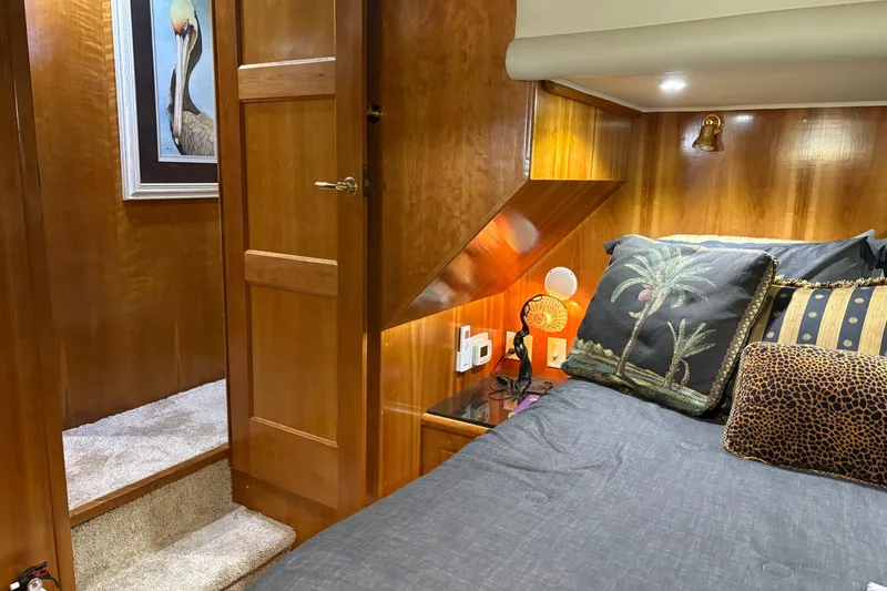 Slide: The Image of Luxurious cabin interior of 2001 Navigator Yacht 5600 Pilothouse Classic with elegant wood finish. - 15