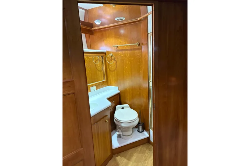 Slide: The Image of Luxurious wooden bathroom interior on 2001 Navigator Yacht 5600 Pilothouse Classic. - 16