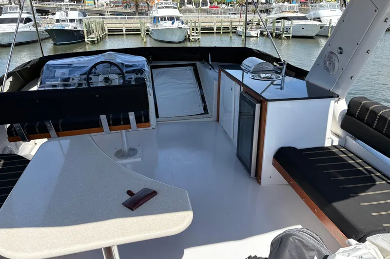 Slide: The Image of Luxurious 2001 Navigator Yacht 5600 Pilothouse Classic interior with seating and helm station. - 24