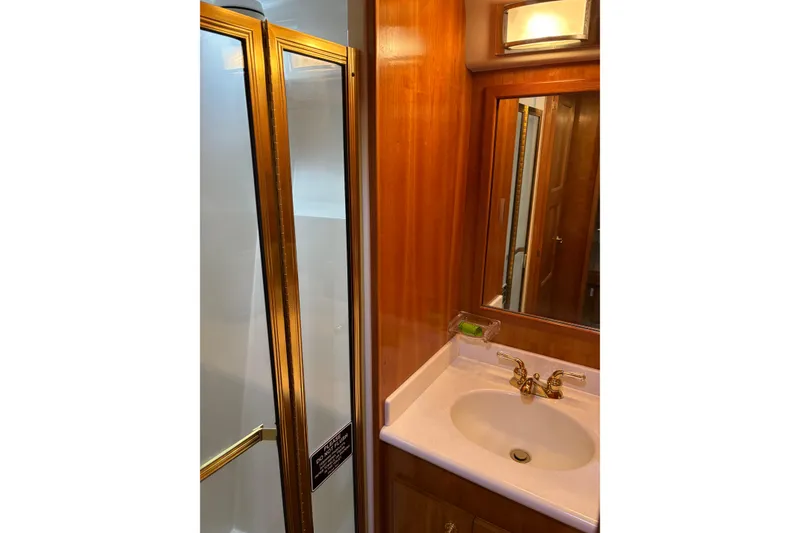 Slide: The Image of Bathroom interior of 2001 Navigator Yacht 5600 Pilothouse Classic with sink and shower. - 32