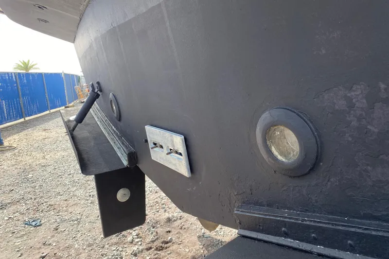 Slide: The Image of Close-up of 2001 Navigator Yacht 5600 Pilothouse Classic hull with fittings and portholes. - 6