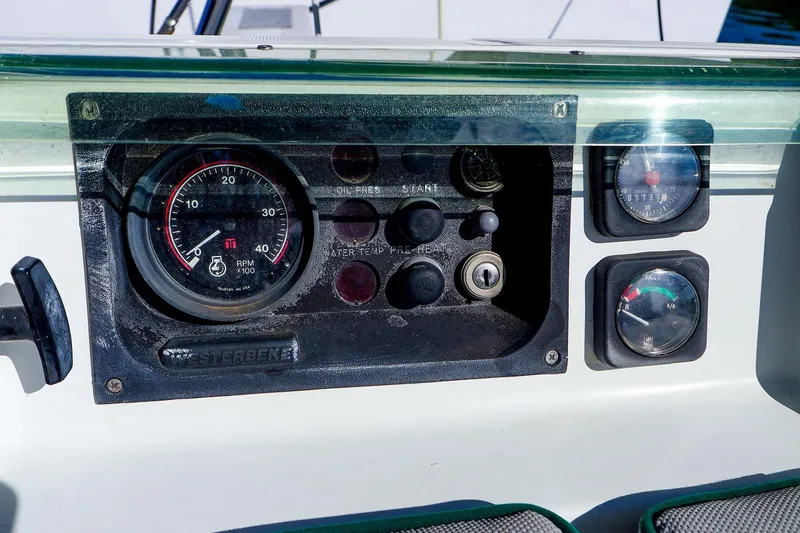 Slide: The Image of Control panel of a 2002 Beneteau Oceanis Clipper 361 sailboat, featuring gauges and switches. - 30