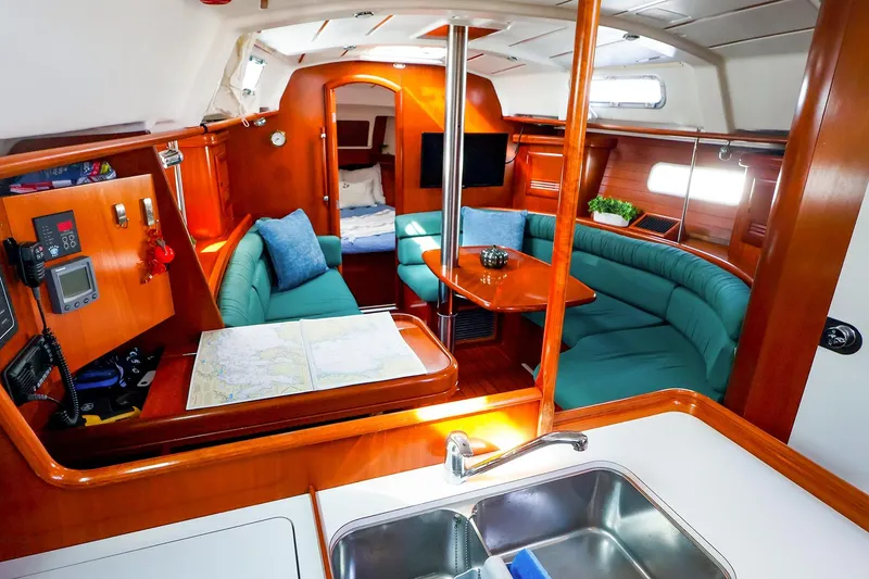 Slide: The Image of Interior of 2002 Beneteau Oceanis Clipper 361 yacht with cozy seating and navigation area. - 37