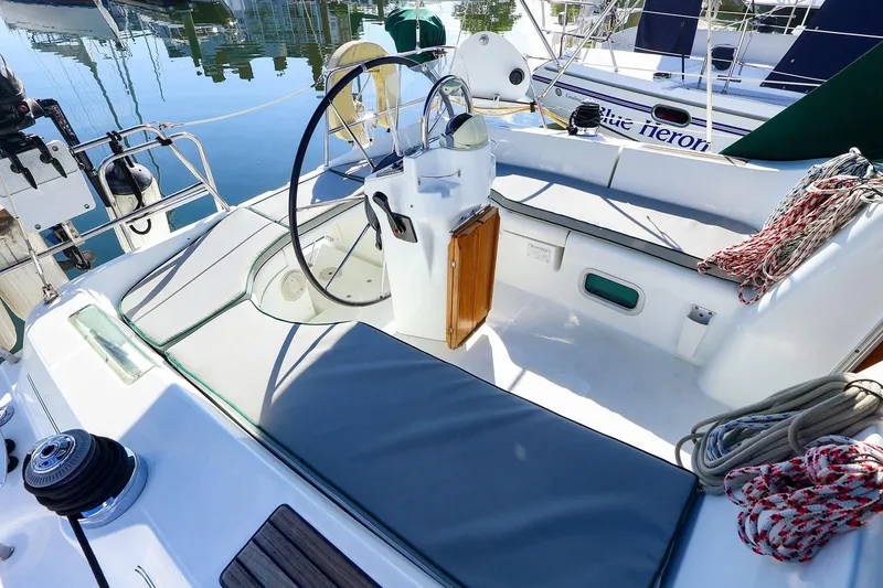 Slide: The Image of Cockpit of 2002 Beneteau Oceanis Clipper 361 sailboat with steering wheel and ropes. - 13