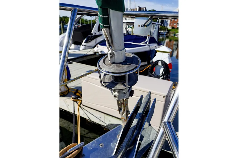 Slide: The Image of Bow of 2002 Beneteau Oceanis Clipper 361 with anchor and marina background. - 17