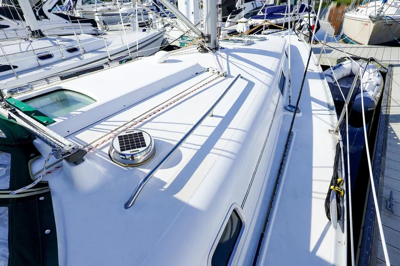 Slide: The Image of 2002 Beneteau Oceanis Clipper 361 sailboat docked, showcasing deck and rigging details. - 16