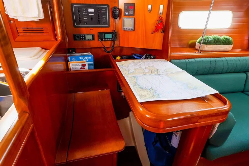 Slide: The Image of Navigation station inside 2002 Beneteau Oceanis Clipper 361 sailboat with chart and instruments. - 46