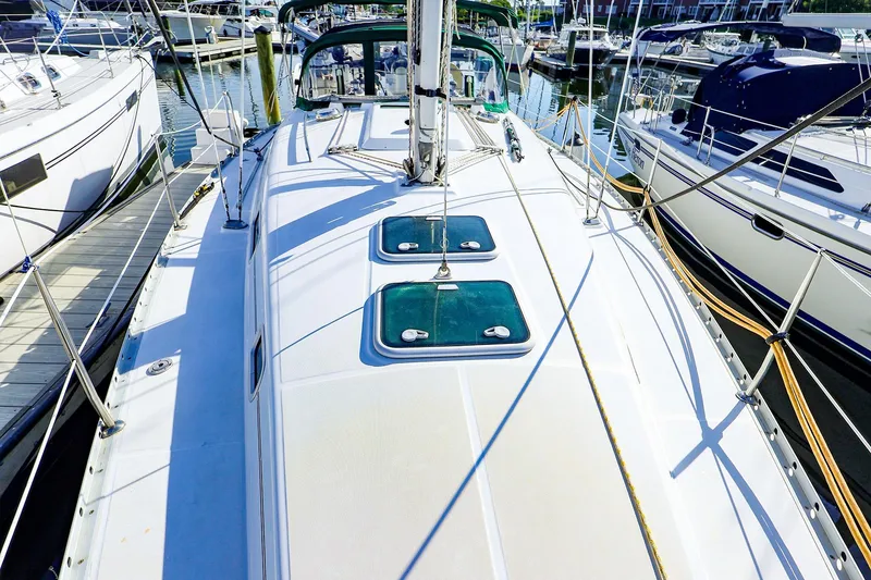Slide: The Image of 2002 Beneteau Oceanis Clipper 361 sailboat docked at marina, top deck view. - 18