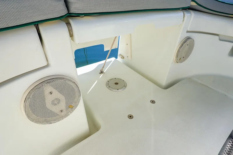 Slide: The Image of Cockpit area of 2002 Beneteau Oceanis Clipper 361 with speakers and seating. - 25