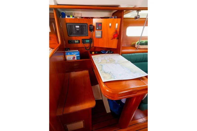 Slide: The Image of Navigation station inside 2002 Beneteau Oceanis Clipper 361 yacht with map and control panel. - 41