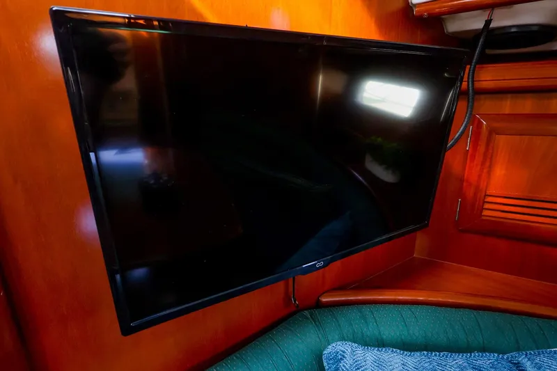 Slide: The Image of Flat-screen TV mounted in the cabin of a 2002 Beneteau Oceanis Clipper 361 yacht. - 45