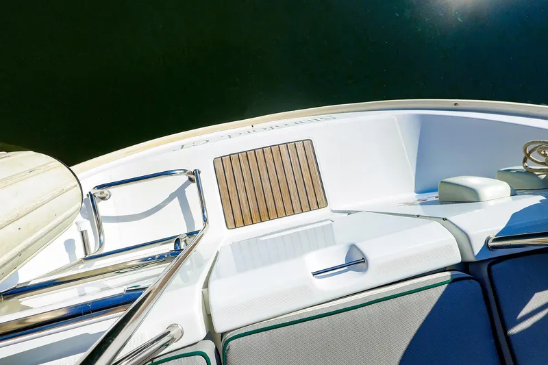 Slide: The Image of 2002 Beneteau Oceanis Clipper 361 yacht deck with wooden accents and stainless steel railings. - 31