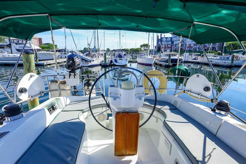 Slide: The Image of Cockpit view of 2002 Beneteau Oceanis Clipper 361 sailboat docked in a marina. - 7