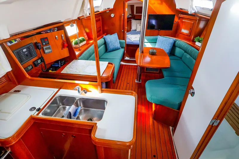 Slide: The Image of Interior of 2002 Beneteau Oceanis Clipper 361 yacht with cozy seating and modern amenities. - 39
