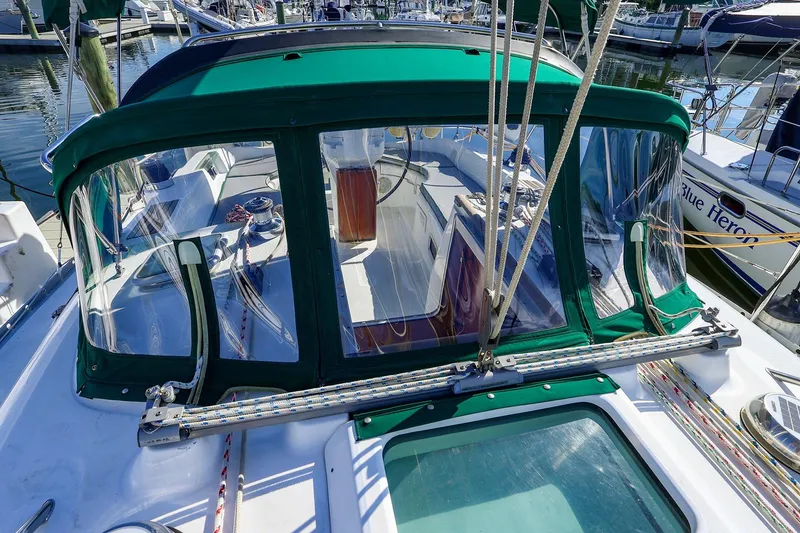 Slide: The Image of 2002 Beneteau Oceanis Clipper 361 sailboat cockpit with green canopy in marina. - 3
