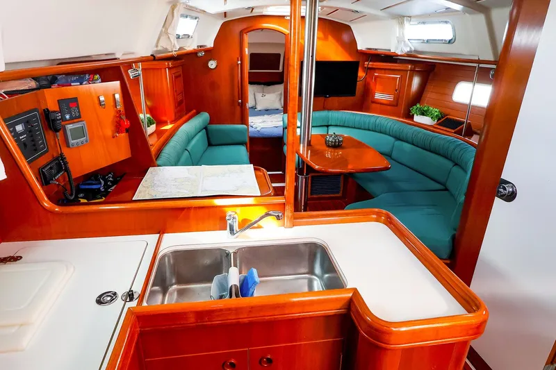 Slide: The Image of Interior of 2002 Beneteau Oceanis Clipper 361 yacht with cozy seating and modern amenities. - 36