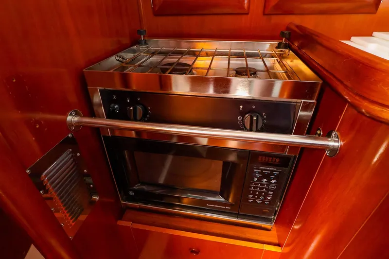 Slide: The Image of Galley kitchen in 2002 Beneteau Oceanis Clipper 361 with stove and microwave. - 50