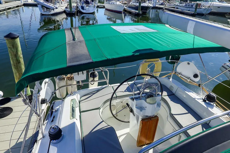 Slide: The Image of 2002 Beneteau Oceanis Clipper 361 sailboat cockpit with green canopy at marina. - 5