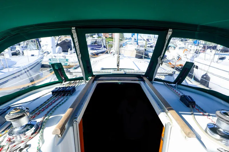 Slide: The Image of Cockpit view of 2002 Beneteau Oceanis Clipper 361 sailboat, featuring winches and rigging. - 9