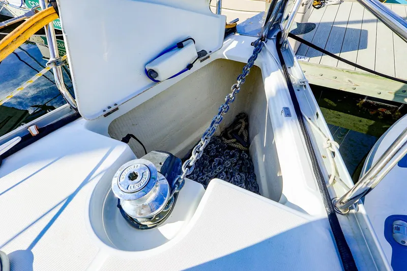 Slide: The Image of Anchor locker of 2002 Beneteau Oceanis Clipper 361 sailboat with chain and winch. - 27