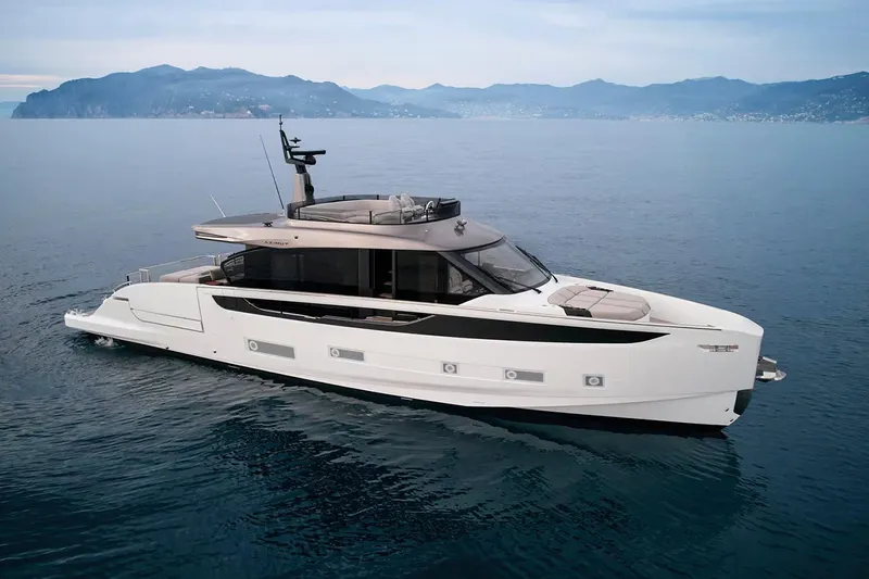 Slide: The Image of Manufacturer Provided Image: 2025 Azimut Seadeck 7 luxury yacht cruising on calm ocean waters. - 2