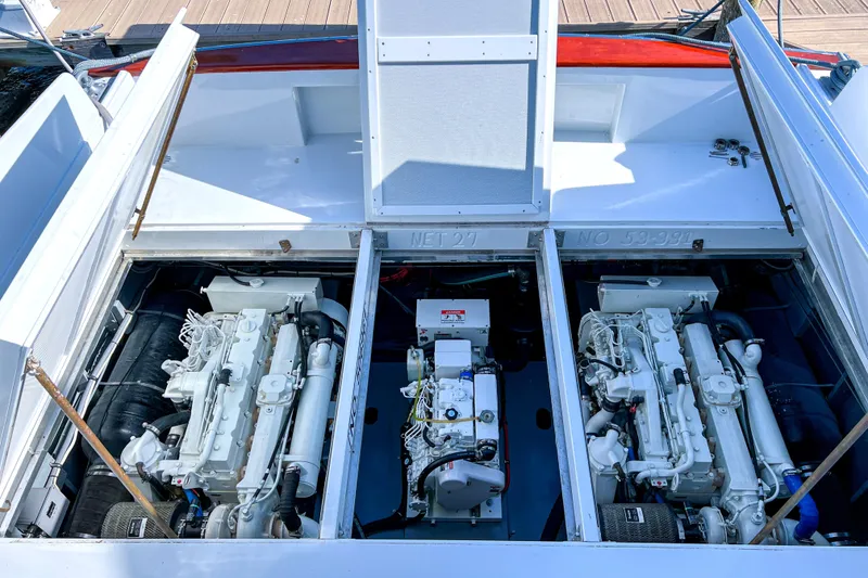 Slide: The Image of Engine compartment of a 1967 Huckins Linwood 53 yacht, showcasing dual engines. - 12