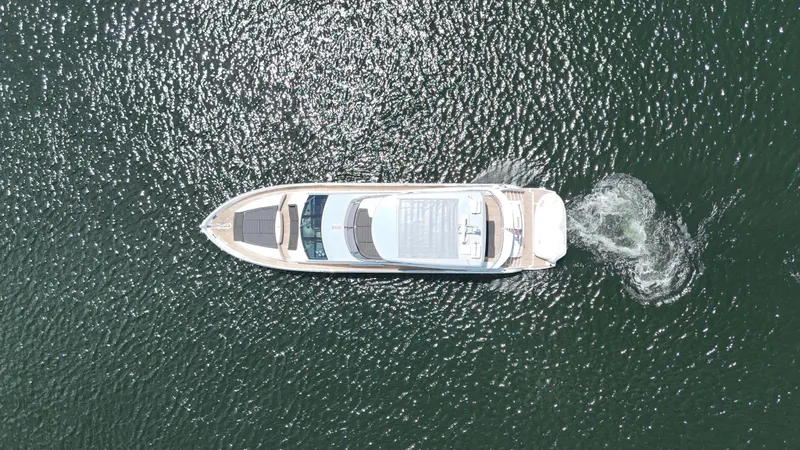 Slide: The Image of Aerial view of 2017 Sunseeker 75 Yacht cruising on shimmering water. - 12